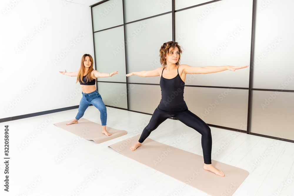 Yoga power. Exercises indoor in the studio. Active healthy life concept Yoga power. Exercises indoor in the studio. Active healthy life concept