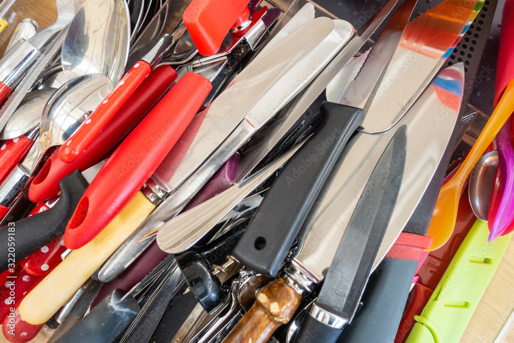 Close up view of kitchen knives and other cutlery Close up view of kitchen knives and other cutlery