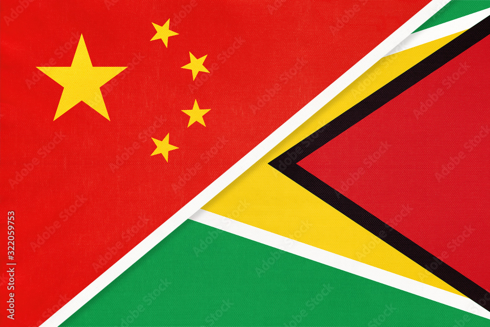 China or PRC vs Guyana national flag from textile. Relationship between asian and american countries. China or PRC vs Guyana national flag from textile. Relationship between asian and american countries.