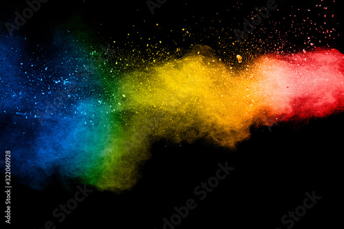 Pastel color dust particle splashing.Colorful powder explosion on white background.