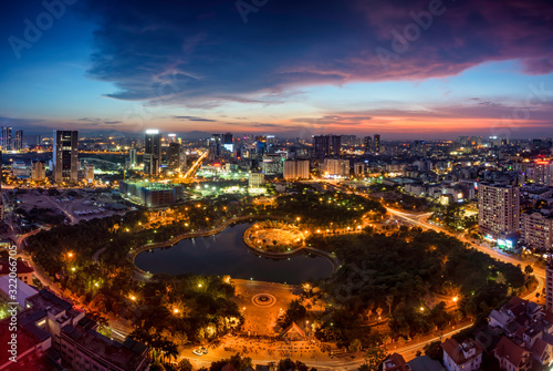 Hanoi skyline cityscape at twilight period. Cau Giay park, west of Hanoi