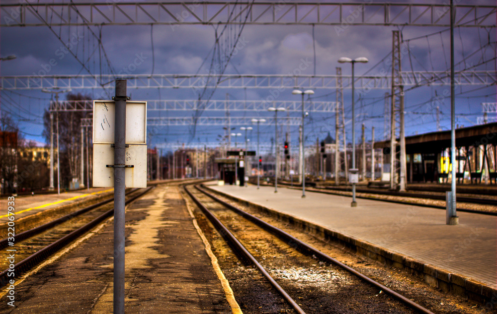 Post on a empty train station platform. No people on train station.