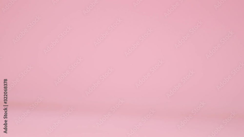 Red toy model car with a golden pattern egg on a pink background. Gift delivery. Happy easter concept