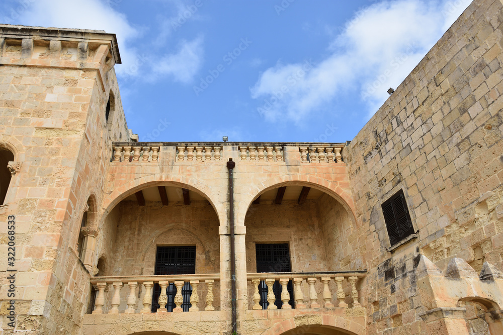 Fort St Angelo (Forti Sant Anglu), beautiful inner courtyard of Magisterial Palace inside the fort, famous historical landmark at Birgu Waterfront, Malta, Vittoriosa bay of the Mediterranean sea