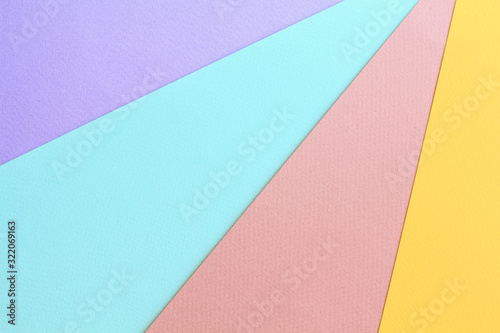 Abstract geometric water color paper background in soft pastel trend colors.