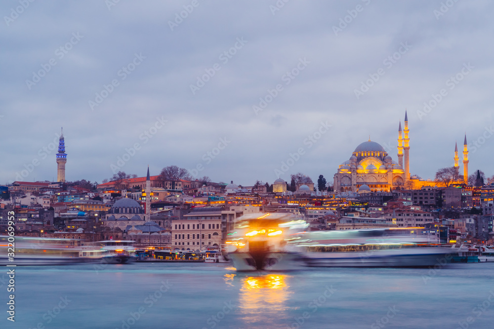 Obraz premium Istanbul, Turkey - Jan 16, 2020: Suleymaniye mosque and passengers Ferry at the Golden Horn, Istanbul, Turkey.