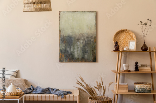 Tableau sur toile Modern composition of living room with design chaise longue, mock up paintings, rattan decoration, pillows, plaid, bamboo shelf and elegant personal accessories