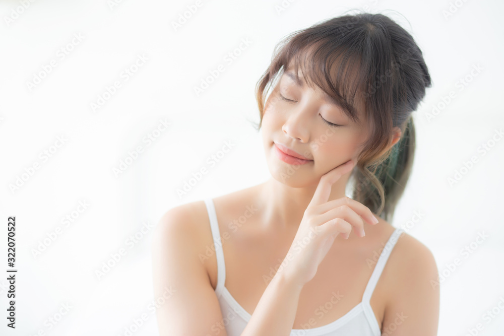 Portrait of beautiful young asian woman smile while wake up healthy and wellness with sunrise at morning in the bedroom, asia girl skin care with happy with fresh, lifestyle and relax concept. Portrait of beautiful young asian woman smile while wake up healthy and wellness with sunrise at morning in the bedroom, asia girl skin care with happy with fresh, lifestyle and relax concept.