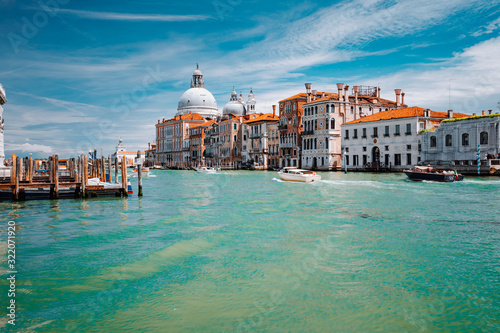 Grand Canal turquoise water and Basilica Santa Maria della Salute against blue sky, Venice, Italy © Igor Tichonow