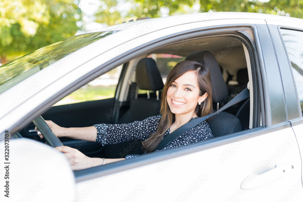 Confident Beautiful Woman Driving Car