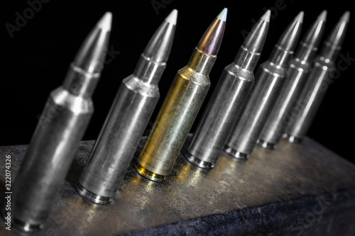 cartridges for a hunting carbine standing on a stand