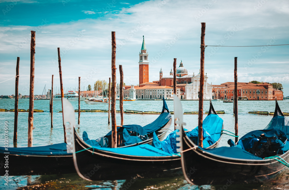 Venice, Italy. Close up of Gondolas and San Giorgio Maggiore church on Grand Canal in background