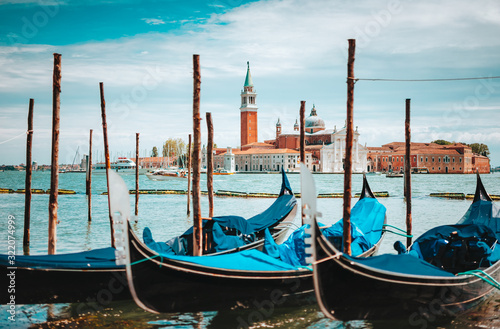 Venice, Italy. Close up of Gondolas and San Giorgio Maggiore church on Grand Canal in background
