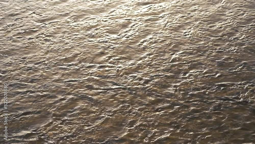 Small frequent waves on the river water Small frequent waves on the river water