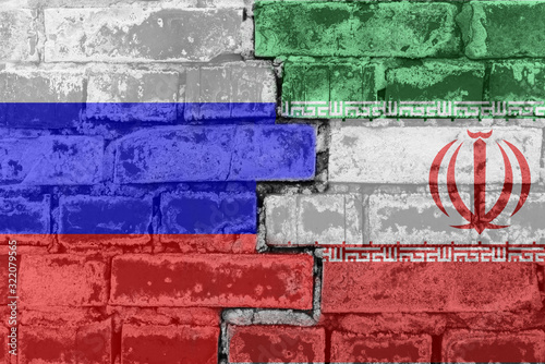 Russia Federation and Iran - National flags on Brick wall. Governments relations and conflict concept.