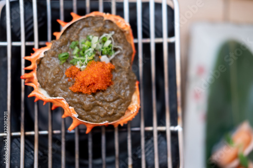 Japanese Kani Miso crab meat with soybean paste grilled in crab shell photo