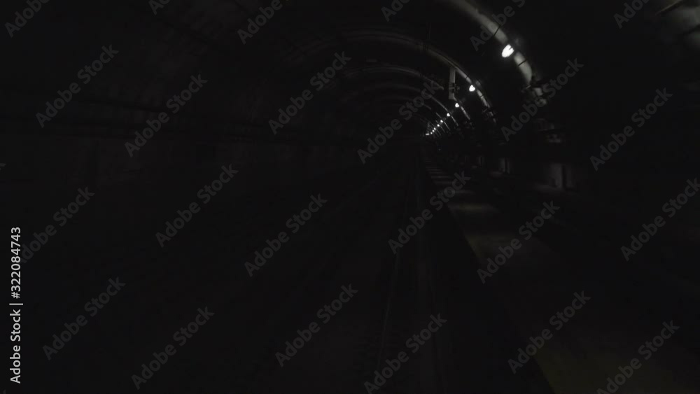 Ultra high definition 4k time lapse video of fast high speed subway train moving through dark tunnel 3840x2160