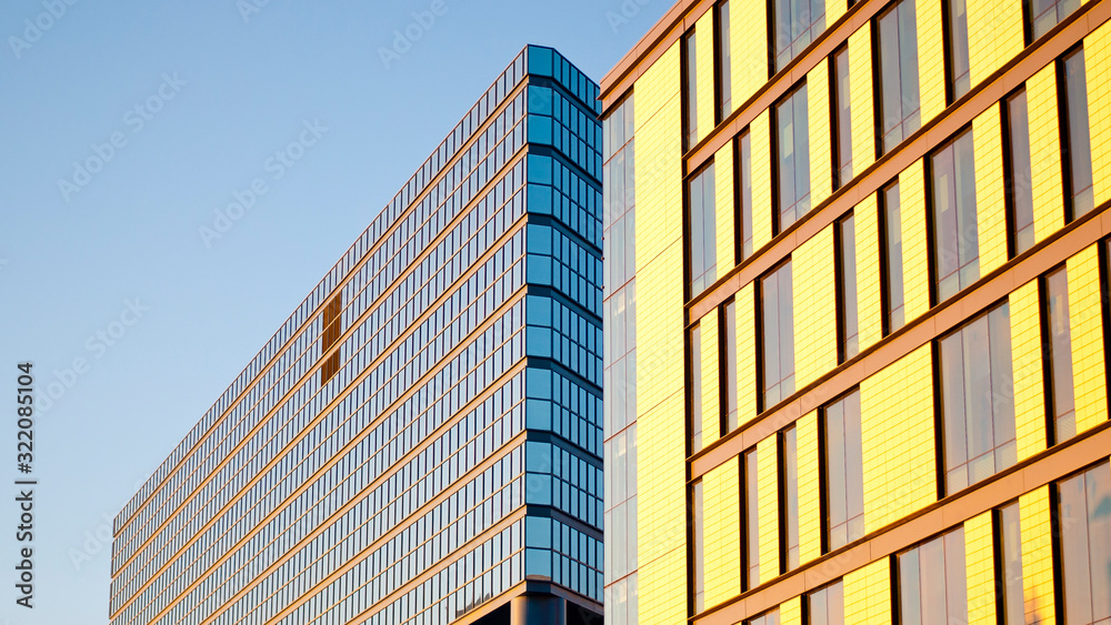 Fototapeta premium Facade of a random building in Calgary, Canada with glass and windows on a sunny winter day.