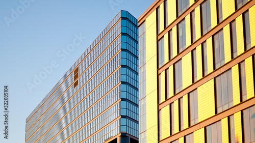 Facade of a random building in Calgary, Canada with glass and windows on a sunny winter day.