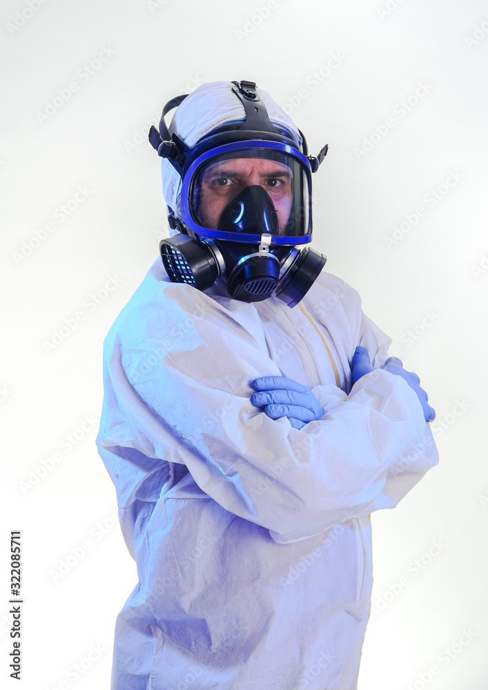 coronavirus epidemic and infectious diseases concept.male lab technician doing research in the lab with protective suit and gas mask.