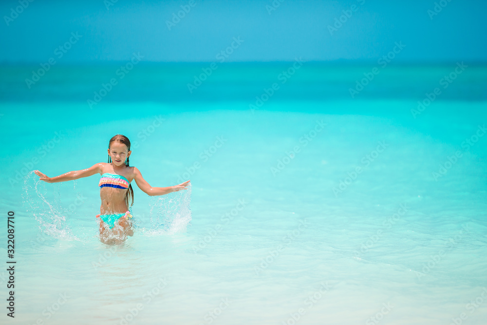 Adorable little girl at beach on her summer vacation Stock Photo
