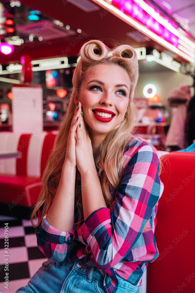 Photo of happy seductive woman smiling while sitting Photo of happy seductive woman smiling while sitting