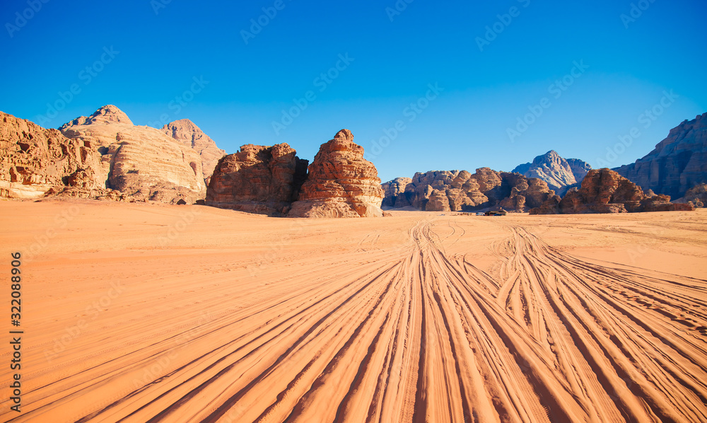 Naklejka premium Sand mountain The Seven Pillars of Wisdom against the blue sky, Jordan, Wadi Rum desert.