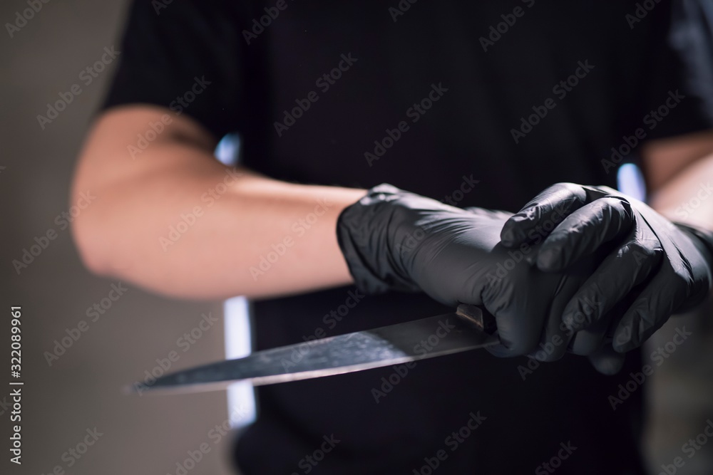 Fototapeta premium man is a criminal holding a weapon