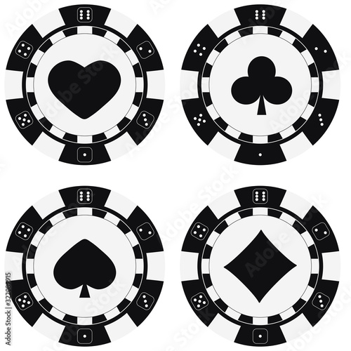 Black and white poker chips set with card suits hearts, spades, diamonds, clubs.
