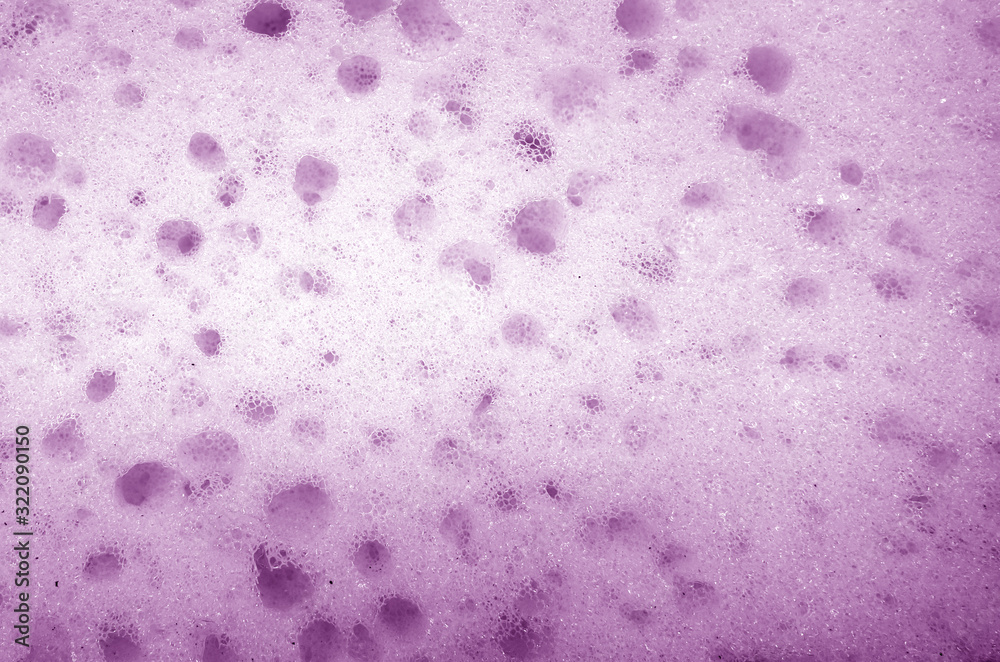 Cleaning sponge surface close up in purple color. Cleaning sponge surface close up in purple color.