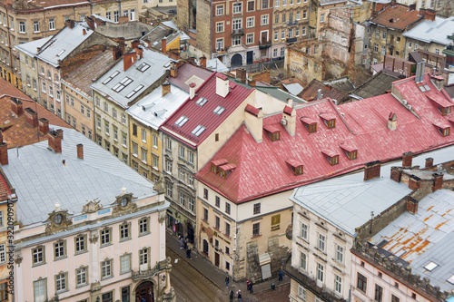 The view from the heights of the rooftops of an old European city. Background for urban architecture. Europe.