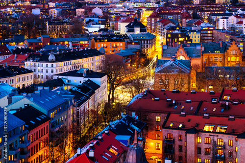 A night view of Sentrum area of Oslo, Norway, with modern and historical buildings photo