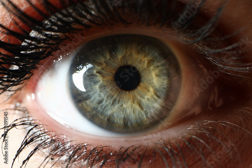 Beaty woman clor eye closeup supermacro background. Laser vision correction concept