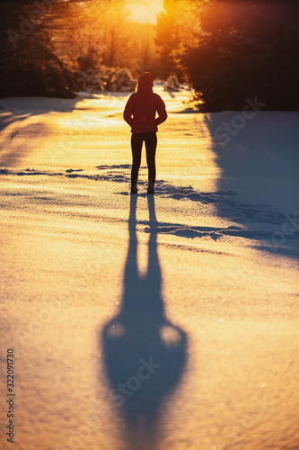 Young female standing on th...