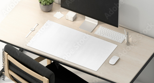 Blank white desk mat on work table mockup, side view photo