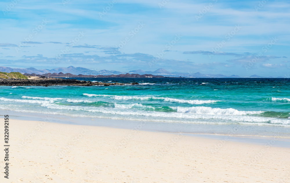 Beach in Fuerteventura, one of Canary Islands. On the horizon there is Island of Lanzarote
