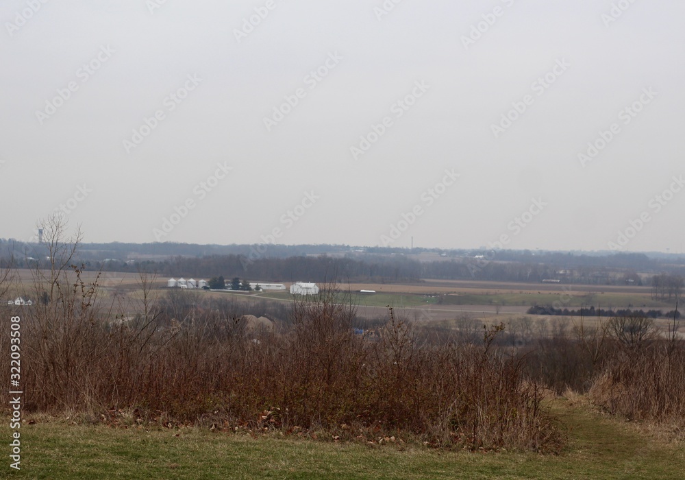 A view of the countryside on a foggy winter cloudy day. A view of the countryside on a foggy winter cloudy day.