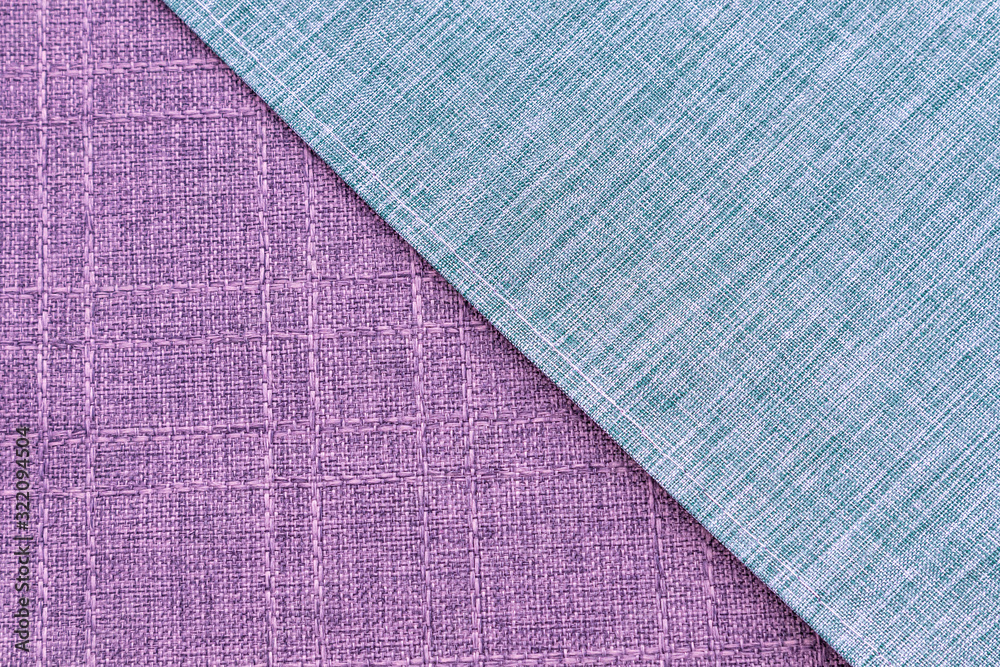 Texture of a blue and purple striped fabric, tablecloth texture, fabrics made by natural dyeing process. Texture of a blue and purple striped fabric, tablecloth texture, fabrics made by natural dyeing process.