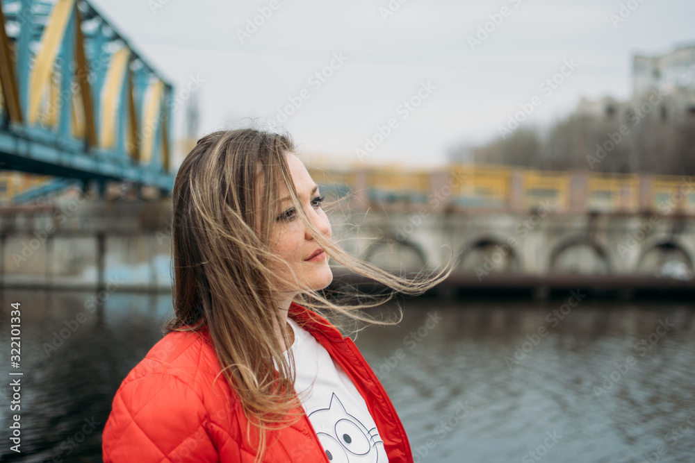 Embrace being single, Mental health, emotional, psychological, social well-being. Close up portrait of beautiful young woman with fluttering hair. Сalm scene, urban city lifestyle