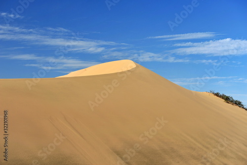 Sand dune and blue sky.