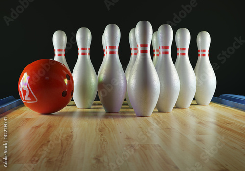 Bowling pins and bowling ball on the alley