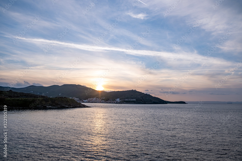 Sunset over Aegean sea, blue sky background, Kea island, Greece.