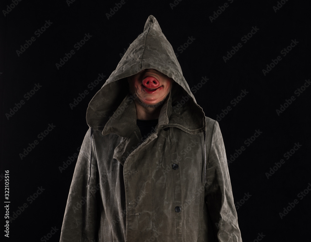 dangerous man in a hood on a black background dangerous man in a hood on a black background