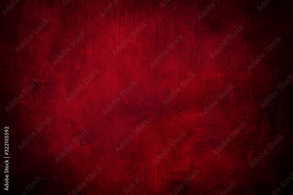 red grunge background or texture with dark vignette borders and spotlight