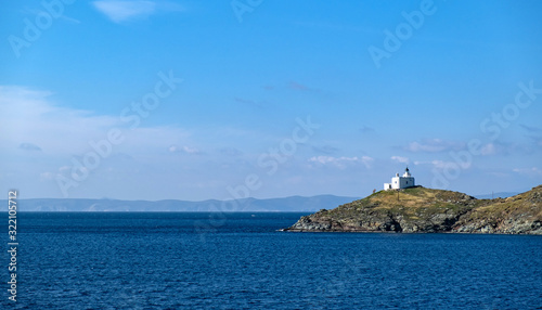 Greece, Kea Tzia island. Seascape with lighthouse, clear blue sky