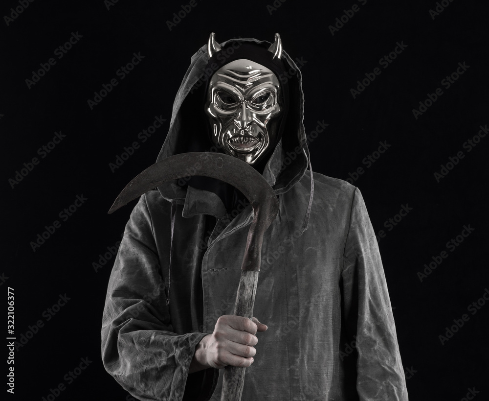 portrait of a man in a devil mask on a black background portrait of a man in a devil mask on a black background
