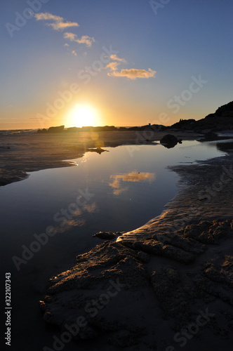 Sunset beach reflections