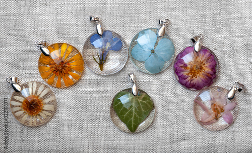 handmade epoxy resin jewelry. pendants. in copper frame. chamomile, calendula, lobelia, hydrangea, rose, delphinium, ivy