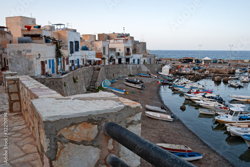Evening panoramic view of the fishing village of the island of Marettimo, in the Egadi Islands in Sicily, Italy. photo