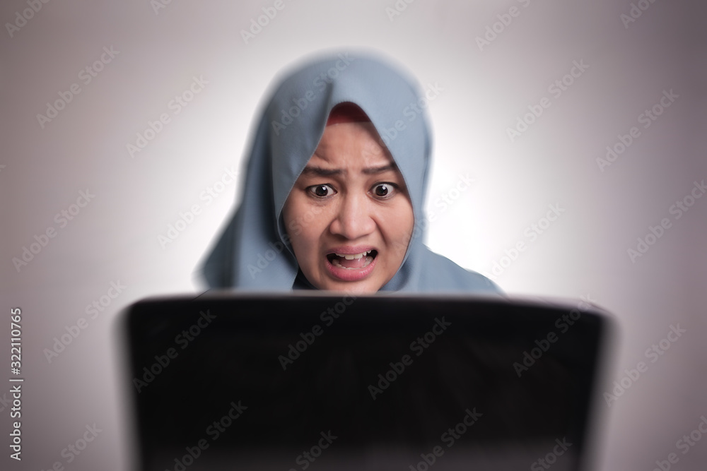 Muslim Woman Working on Laptop Shocked Stunned gesture Muslim Woman Working on Laptop Shocked Stunned gesture